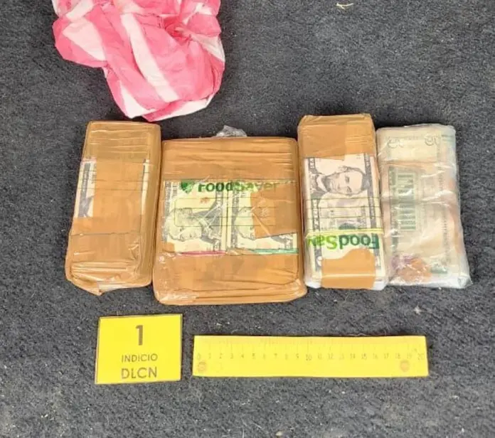 Hallan $7 mil y cocaína en vehículo decomisado en Yoro